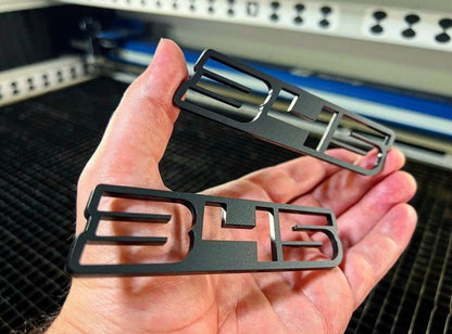 345 Matte Black Hollow Cut Badges (2 included) - Forged Concepts